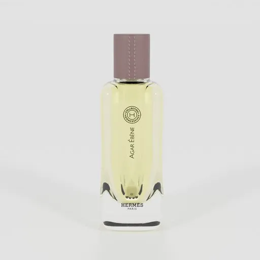Perfume bottle in a 3D-rendered studio setup with professional lighting.