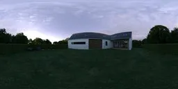 12K panoramic HDR of a serene garden with house, green lawn, trimmed hedges, and purple flowers at sunrise.