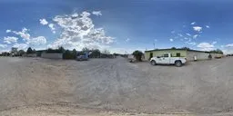 360-degree HDR image featuring a gravel road with cloudy blue sky, ideal for realistic lighting in 3D urban environments.