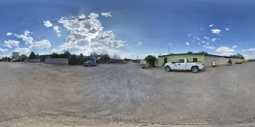 360-degree HDR image featuring a gravel road with cloudy blue sky, ideal for realistic lighting in 3D urban environments.