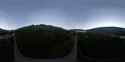 High-quality HDR panoramic image of sunrise over mountains with clear skies for realistic scene lighting.