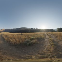 Panoramic HDR image of golden hills with a sun flare for realistic lighting in 3D scenes.
