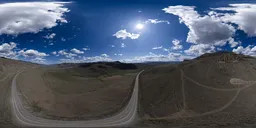 High-resolution sunny HDR sky for 3D rendering, featuring a road cutting through rolling hills.