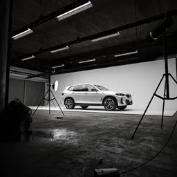 Realistic 3D-rendered garage studio setup showcasing a car model, crafted with Blender for creative professionals.