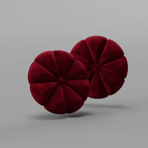 High-resolution 3D velvet cushion model resembling a red blossom, suitable for photorealistic interior renderings in Blender.