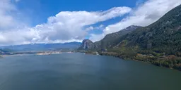 High-resolution HDR image of Squamish inlet surrounded by mountains and clouds for scene lighting.