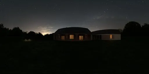 House with illuminated windows at night in lush garden with purple flowers, 12K HDR for scene lighting