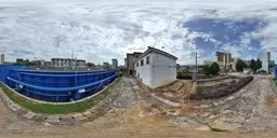 360-degree HDR panorama featuring an overcast sky above urban infrastructure for scene lighting.