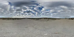 360-degree HDR panorama of a dramatic cloudy sunset over a rocky terrain for scene lighting.