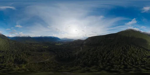 High-resolution HDR image featuring sun peeking through clouds over lush Canadian mountains, ideal for realistic 3D scene lighting.