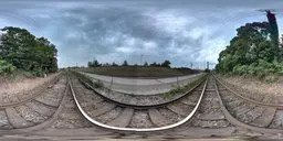 360-degree panoramic HDR image featuring railway lines under overcast skies, ideal for realistic lighting in 3D urban scenes.