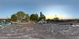 360-degree urban HDR panorama of a dilapidated building site at sunset for realistic light mapping in 3D scenes.