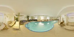 360-degree HDR panorama of a well-lit indoor swimming pool with lounge area for realistic scene lighting.