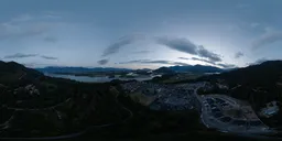 360-degree HDR panorama capturing sunset over a serene Canadian landscape with water, trees, and distant mountains.