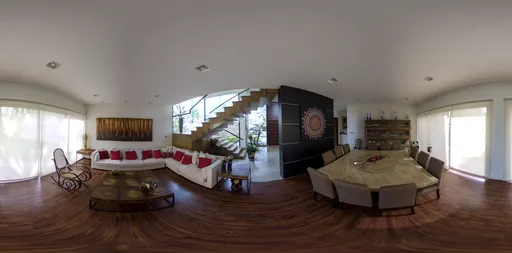 Spacious combined living and dining room with modern decor and ample natural light for 3D scene lighting.