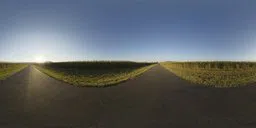 360-degree HDR panorama of a serene road between fields for realistic lighting and reflection in 3D scenes.