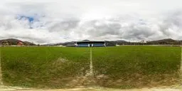 A soccer field on a cloudy day