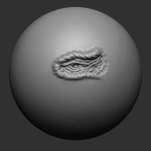 3D sculpting brush for Blender creating detailed eye cavity on dragon model.
