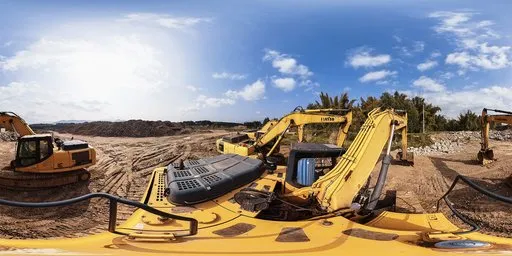Yellow excavator on construction site with blue sky and scattered clouds for realistic scene lighting.